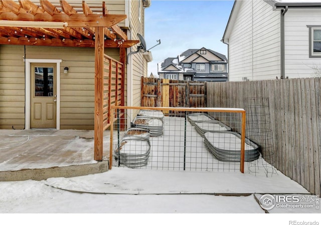 exterior space featuring fence and a pergola