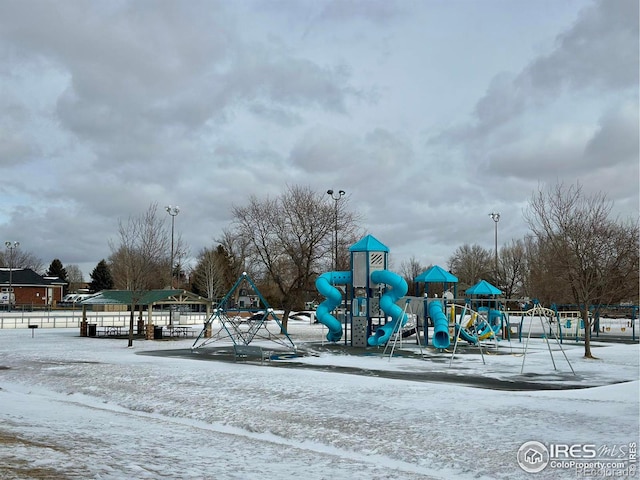 snow covered playground featuring playground community