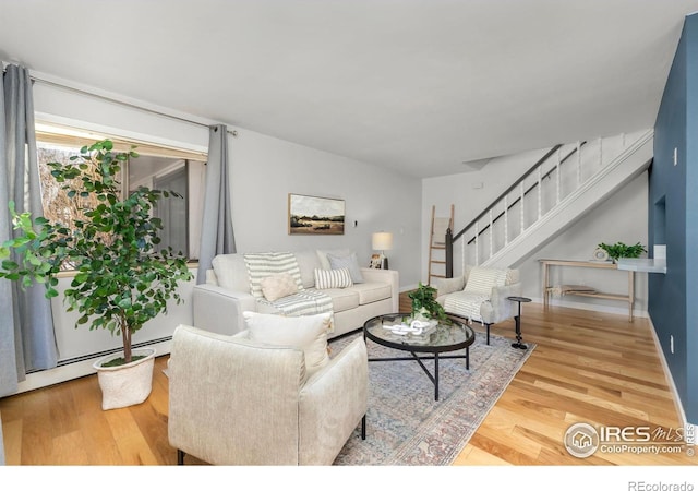 living room featuring hardwood / wood-style flooring and a baseboard radiator