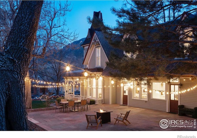 view of patio featuring an outdoor fire pit