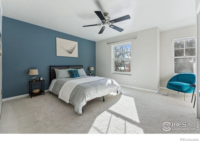 bedroom featuring ceiling fan and light colored carpet