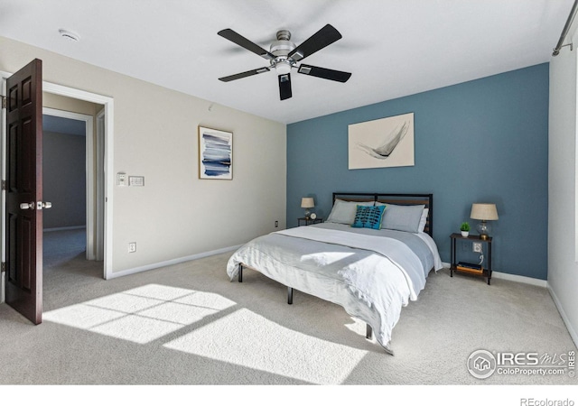 bedroom with ceiling fan and light colored carpet