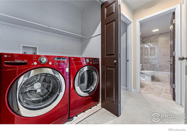 washroom with washer and clothes dryer