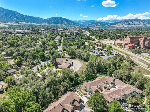 birds eye view of property featuring a mountain view