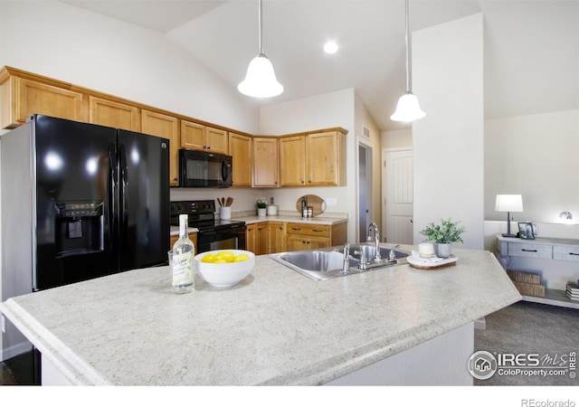 kitchen featuring black appliances, sink, pendant lighting, an island with sink, and vaulted ceiling