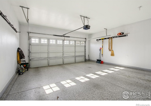 garage featuring a garage door opener