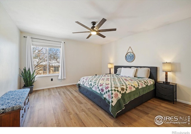 bedroom featuring ceiling fan and hardwood / wood-style floors