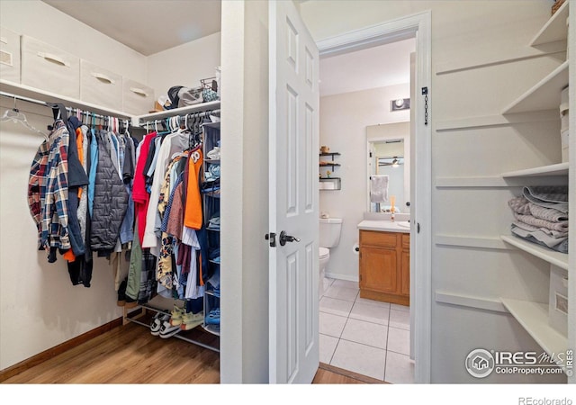 spacious closet with light tile patterned flooring