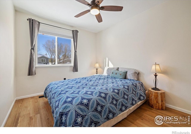 bedroom featuring wood-type flooring and ceiling fan