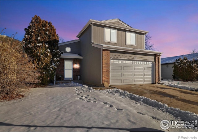 front of property with a garage