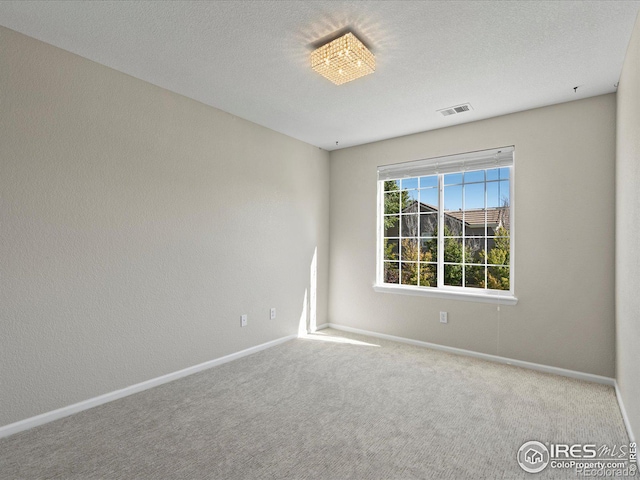 empty room featuring carpet flooring