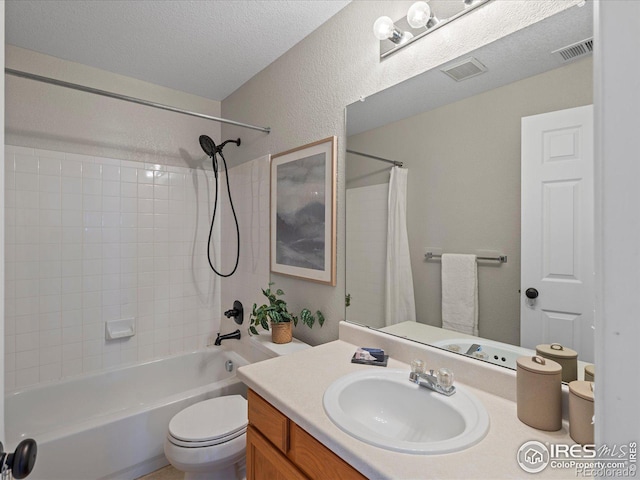 full bathroom featuring toilet, vanity, a textured ceiling, and shower / bath combo with shower curtain