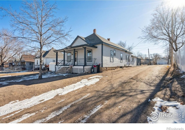 view of front of property featuring covered porch