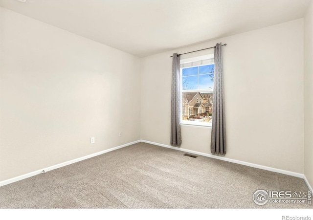 spare room featuring carpet flooring