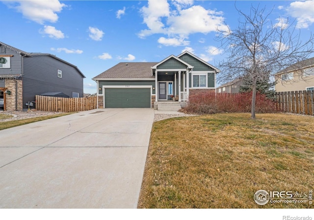 view of front of house with a garage and a front lawn