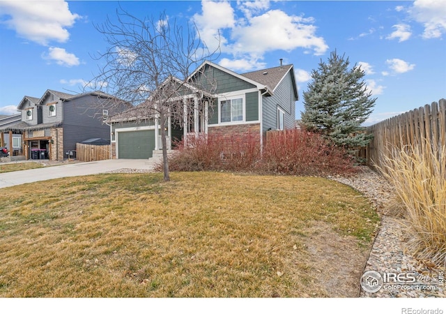 view of front facade with a front yard and a garage