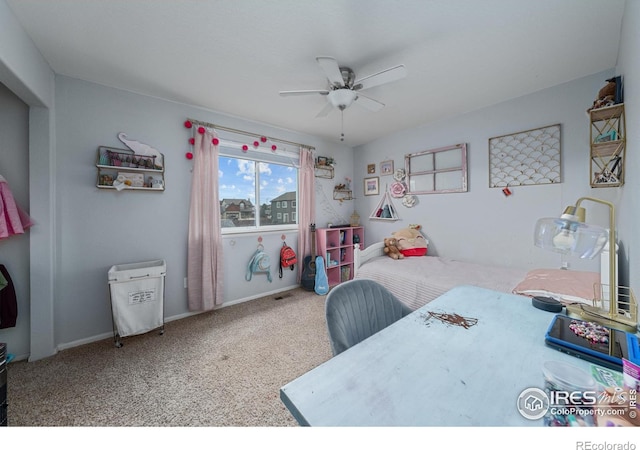 bedroom featuring ceiling fan and carpet