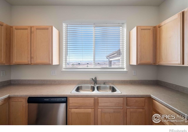 kitchen with sink, light brown cabinets, and dishwasher