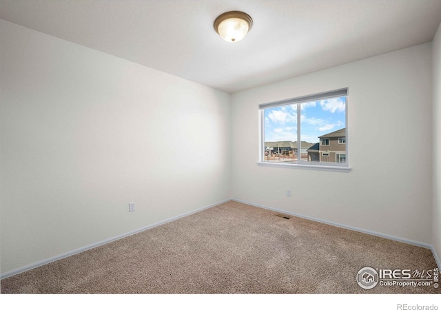 view of carpeted spare room