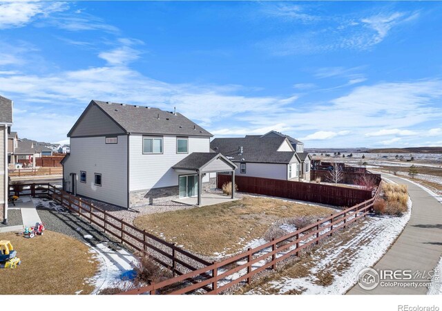 snow covered property featuring a patio area