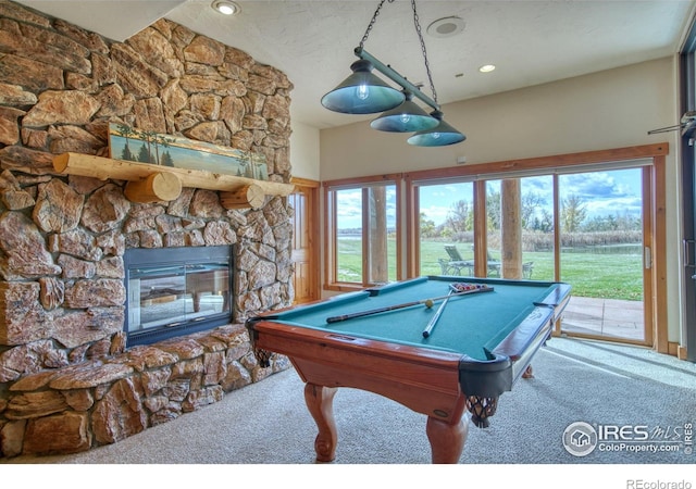 rec room with pool table, a fireplace, and carpet