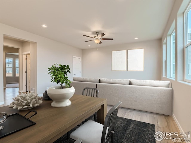 dining area featuring ceiling fan and light hardwood / wood-style floors