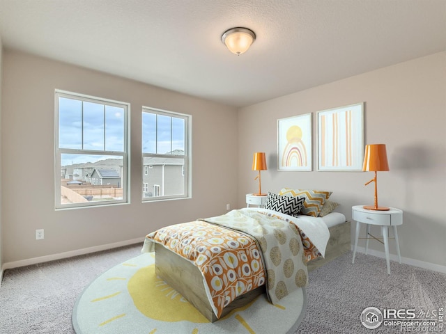 bedroom featuring light colored carpet