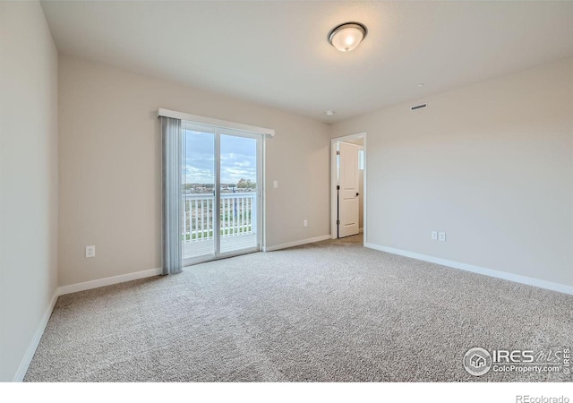 spare room featuring carpet flooring