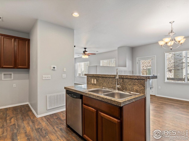 kitchen featuring sink, dishwasher, ceiling fan with notable chandelier, hanging light fixtures, and dark hardwood / wood-style floors