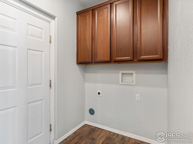 laundry room with washer hookup, hookup for an electric dryer, cabinets, and dark wood-type flooring