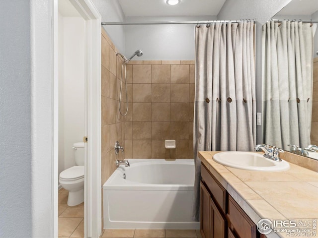 full bathroom featuring shower / bathtub combination with curtain, vanity, tile patterned floors, and toilet