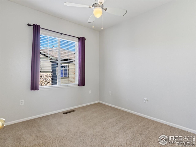 unfurnished room with carpet floors and ceiling fan