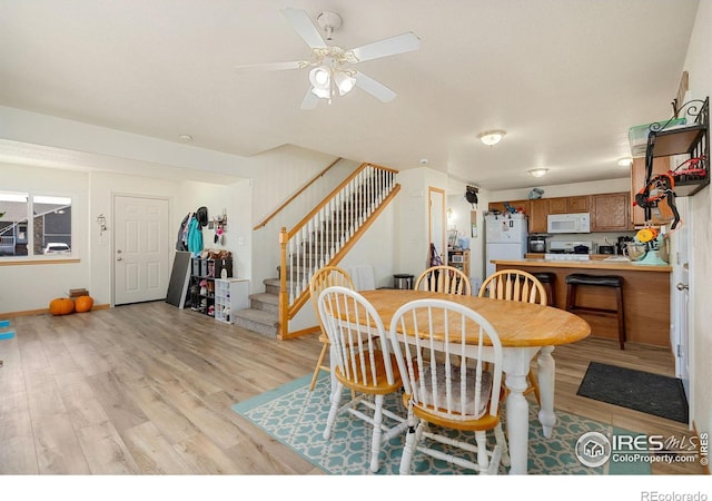 dining room featuring ceiling fan and light hardwood / wood-style floors