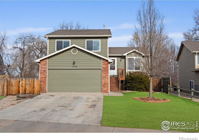 view of front of house featuring a front lawn and a garage