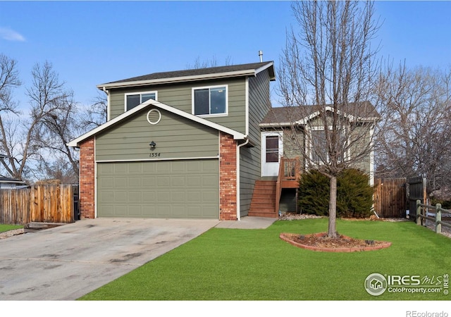 view of property with a garage and a front yard