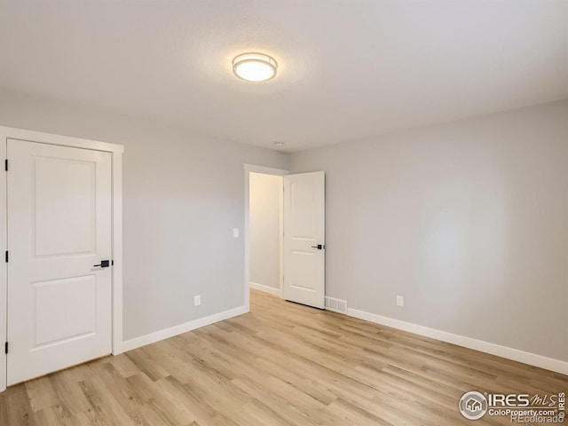 unfurnished room featuring light wood-type flooring