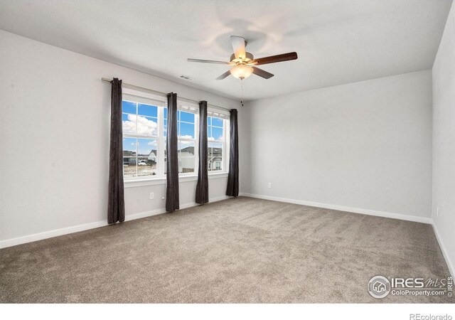 carpeted empty room with ceiling fan