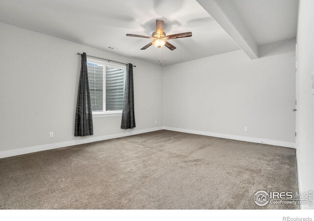 carpeted spare room featuring ceiling fan