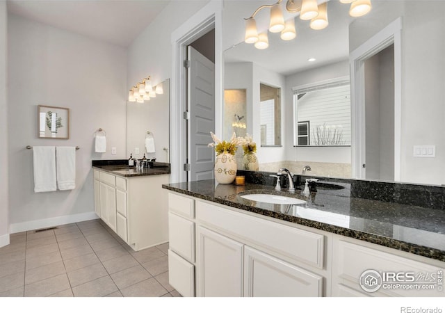 bathroom with tile patterned floors and vanity