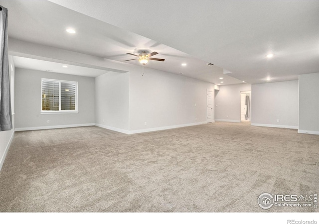 carpeted empty room with ceiling fan