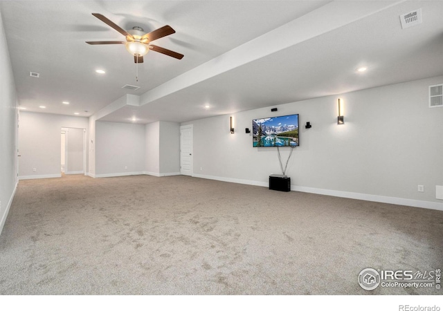 basement featuring ceiling fan and carpet flooring