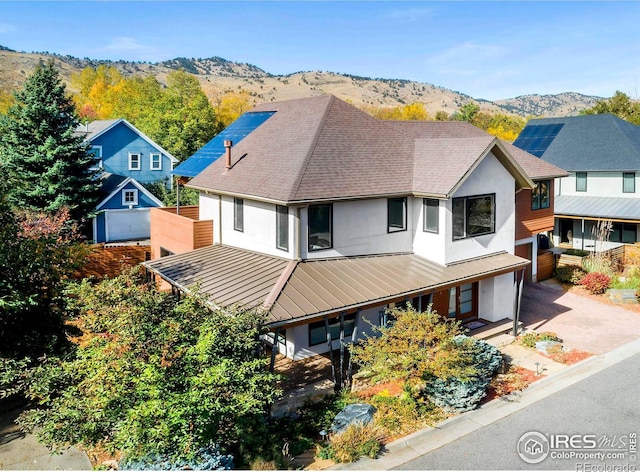 view of front of property with a mountain view