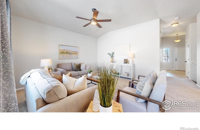 living room featuring ceiling fan and vaulted ceiling