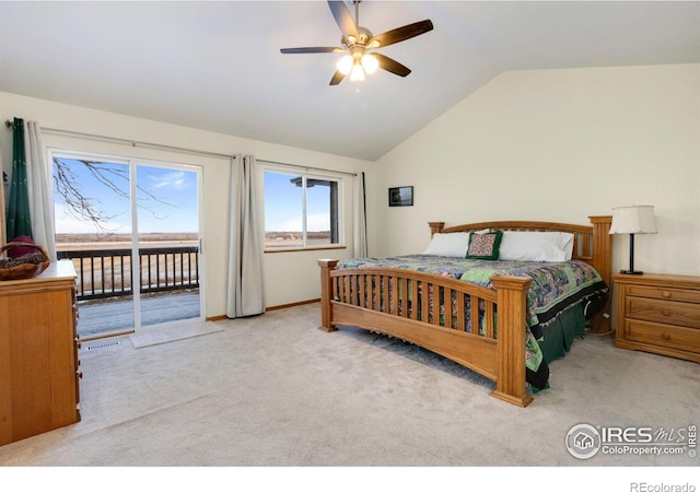 bedroom featuring ceiling fan, light colored carpet, vaulted ceiling, and access to exterior