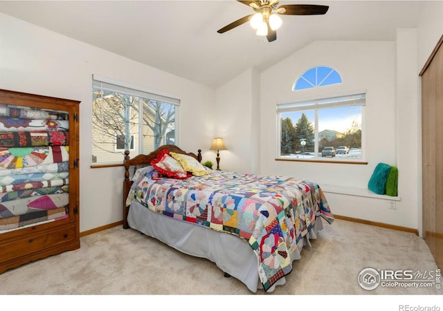 bedroom with light carpet, ceiling fan, and vaulted ceiling