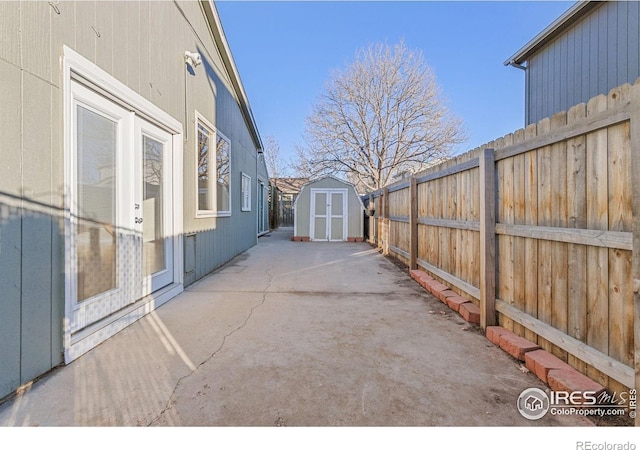 view of patio featuring a storage shed