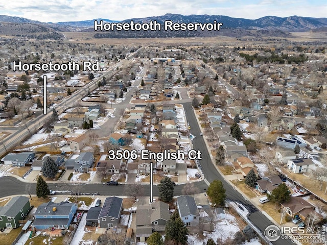 birds eye view of property with a mountain view