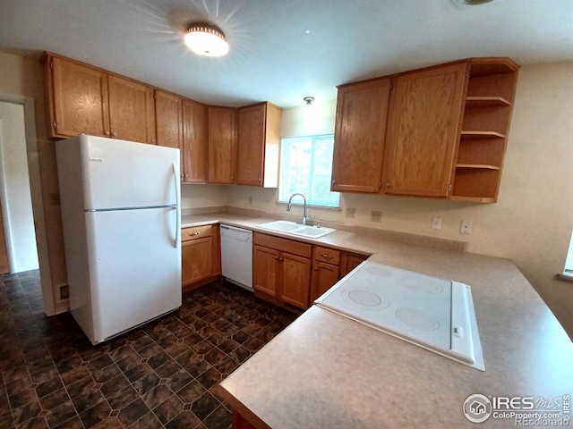 kitchen featuring sink and white appliances