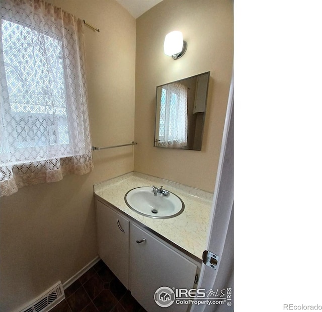 bathroom with vanity and tile patterned floors