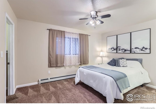 carpeted bedroom with ceiling fan and a baseboard radiator